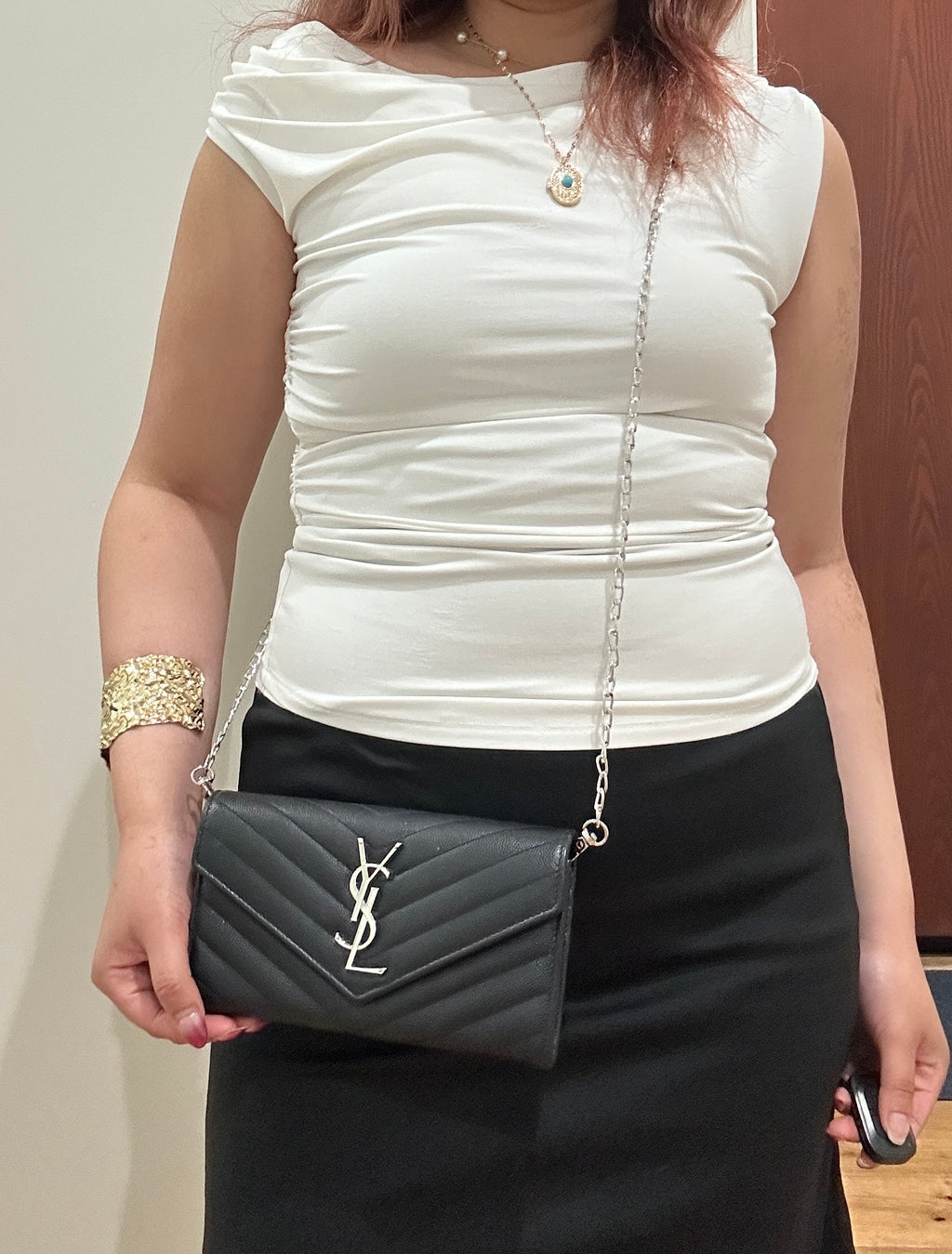 Black YSL cassandre envelope wallet on chain