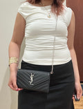 Black YSL cassandre envelope wallet on chain