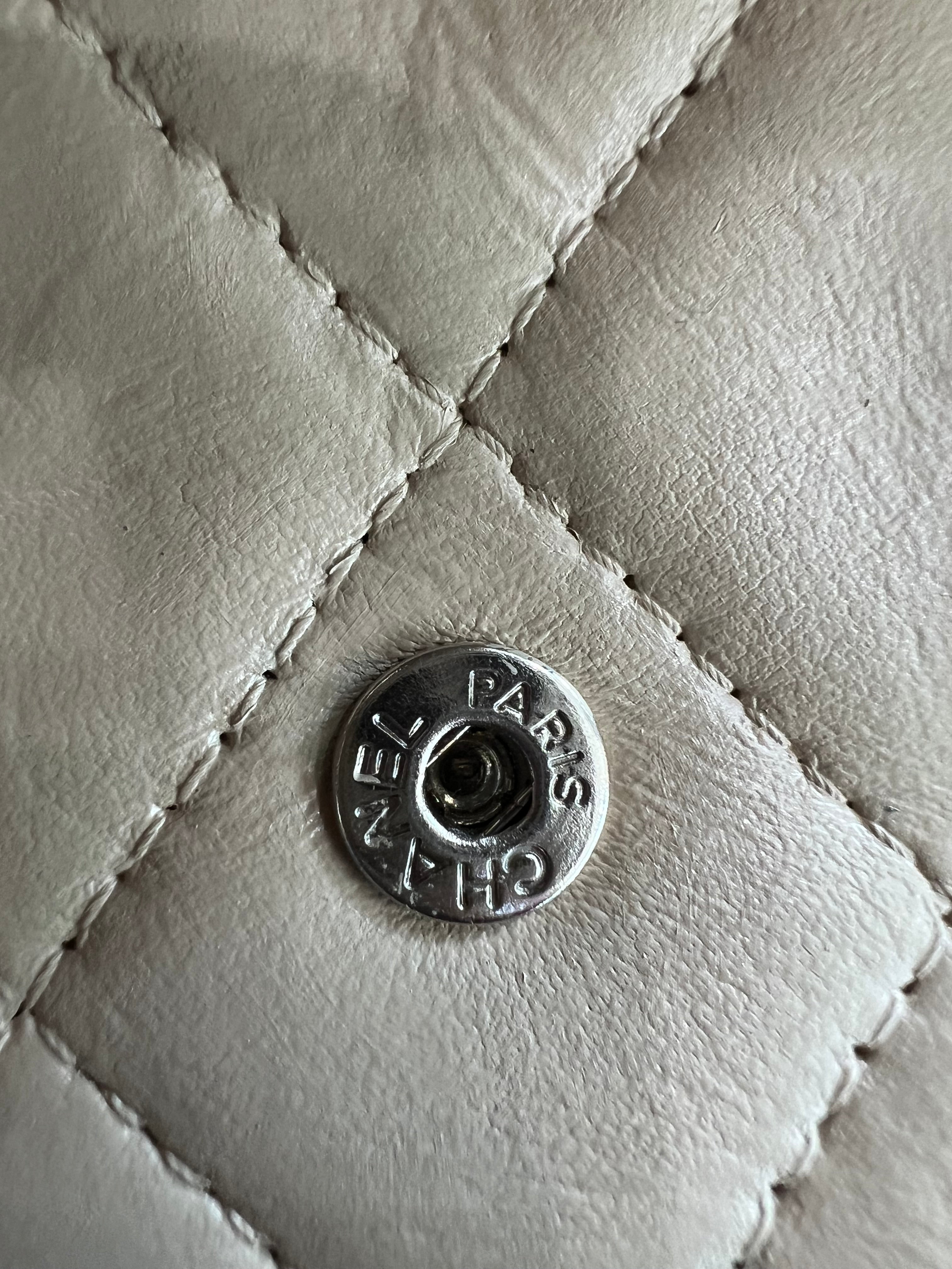Beige gusseted Chanel timeless wallet on chain