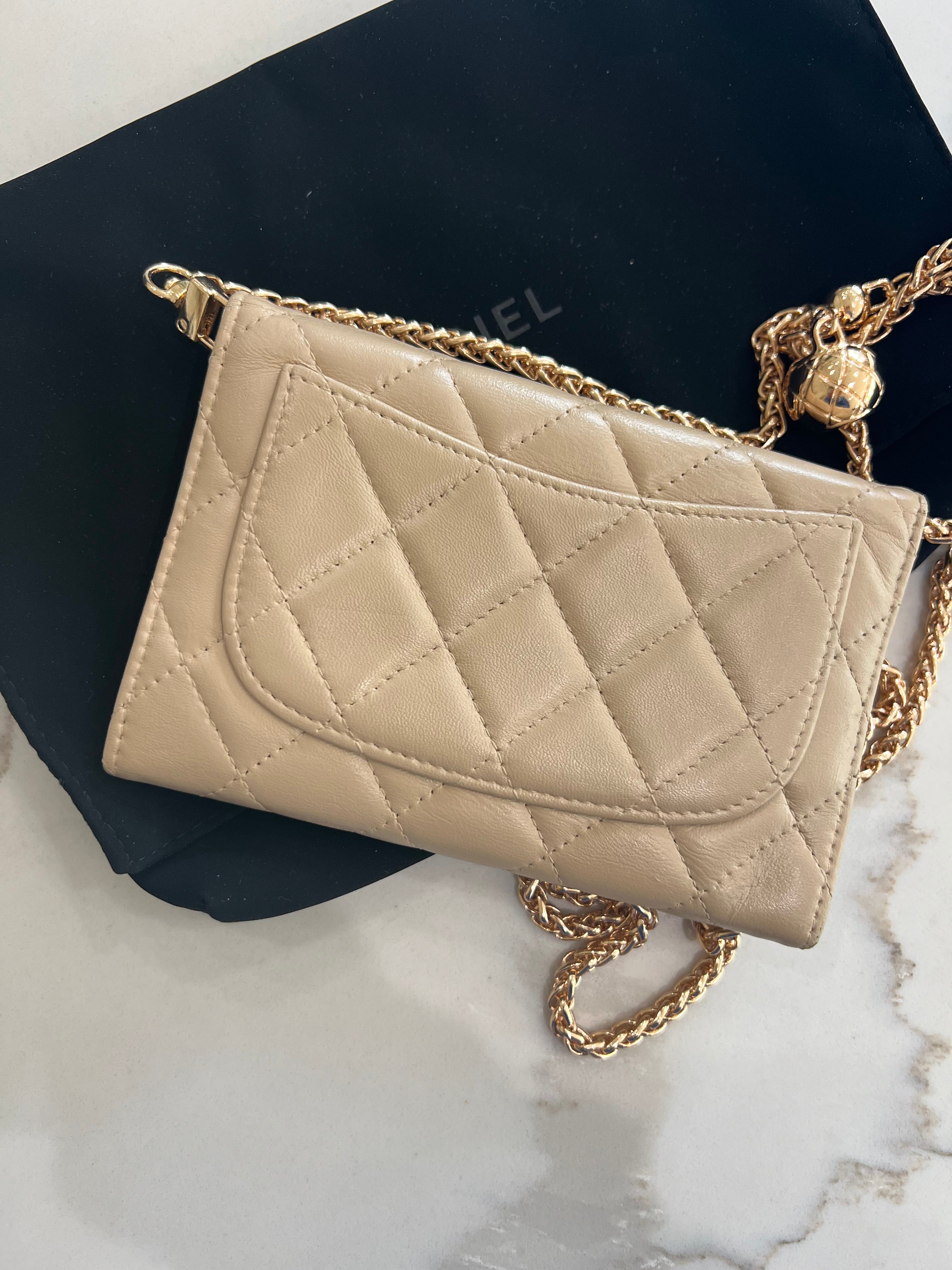 Beige gusseted Chanel timeless wallet on chain