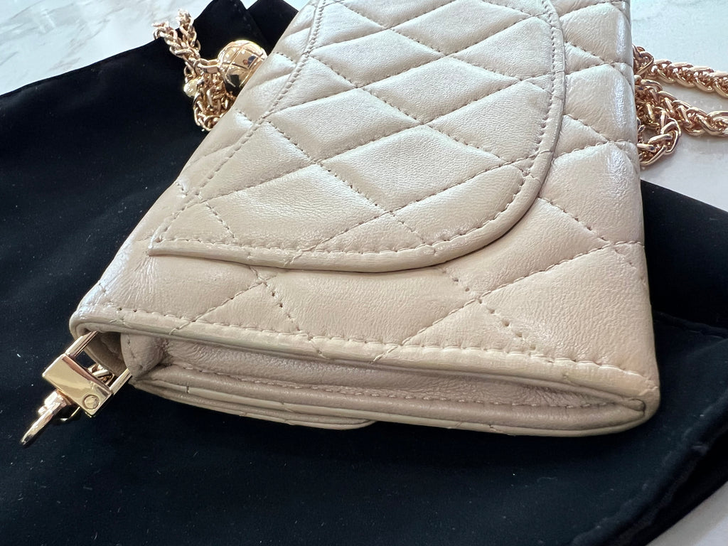 Beige gusseted Chanel timeless wallet on chain