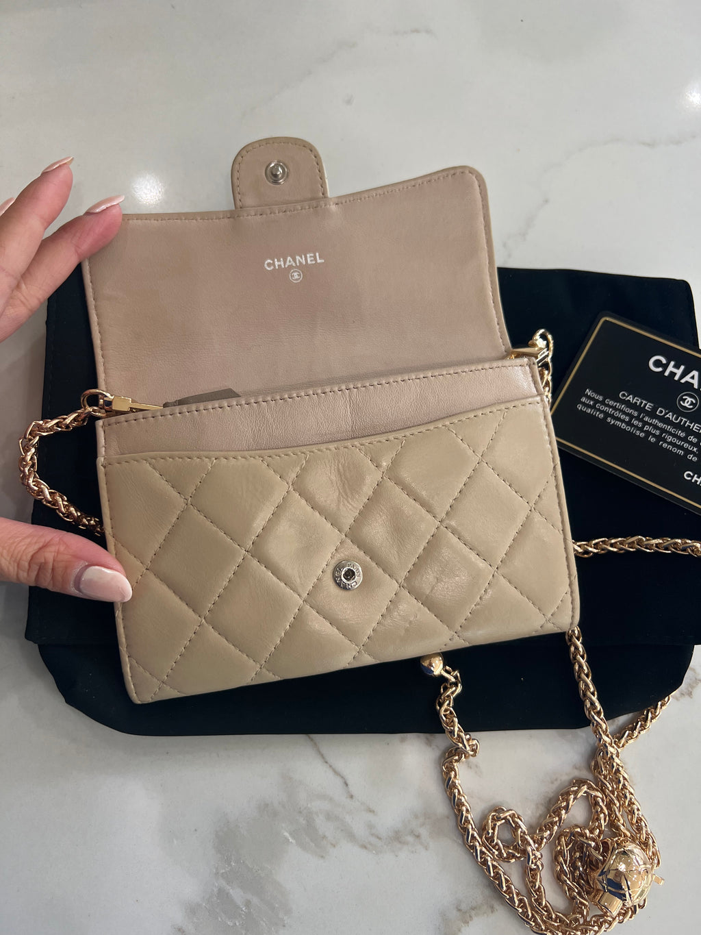 Beige gusseted Chanel timeless wallet on chain