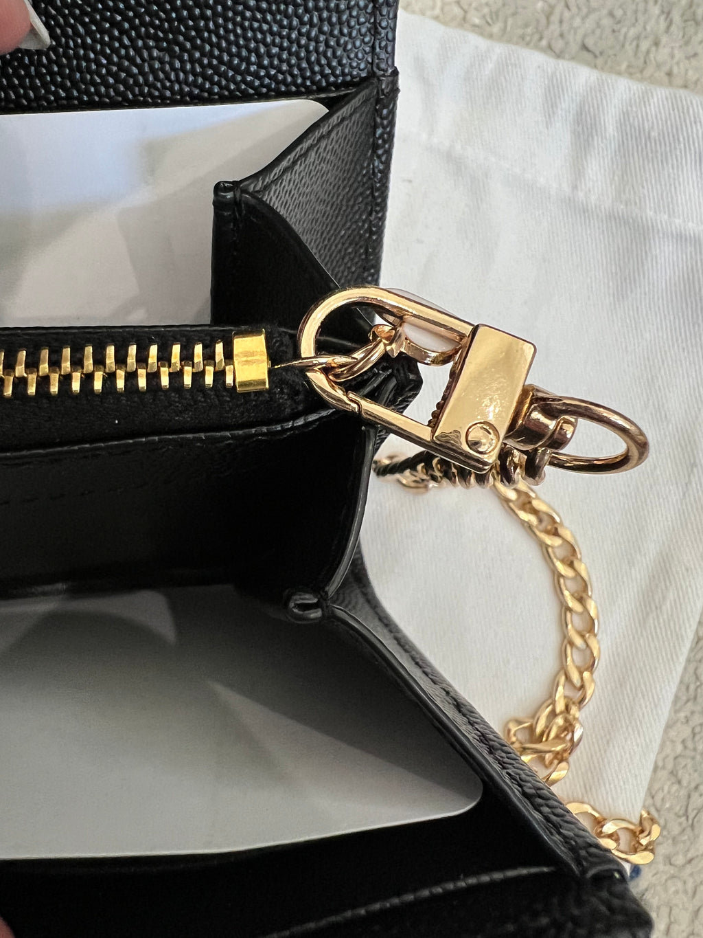 Black YSL cassandre envelope wallet on chain