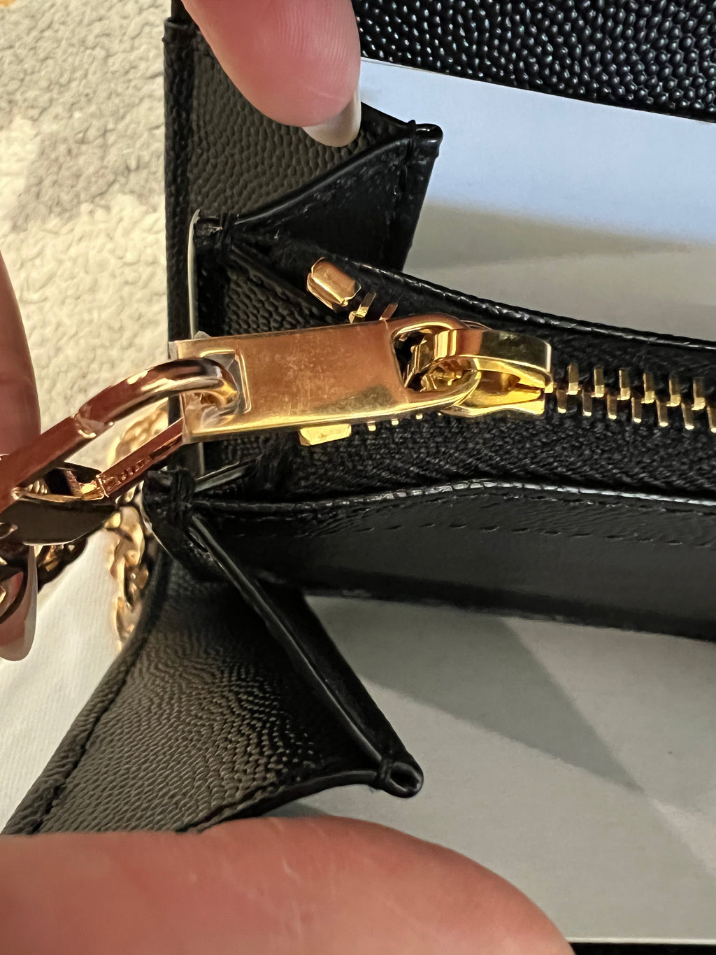 Black YSL cassandre envelope wallet on chain