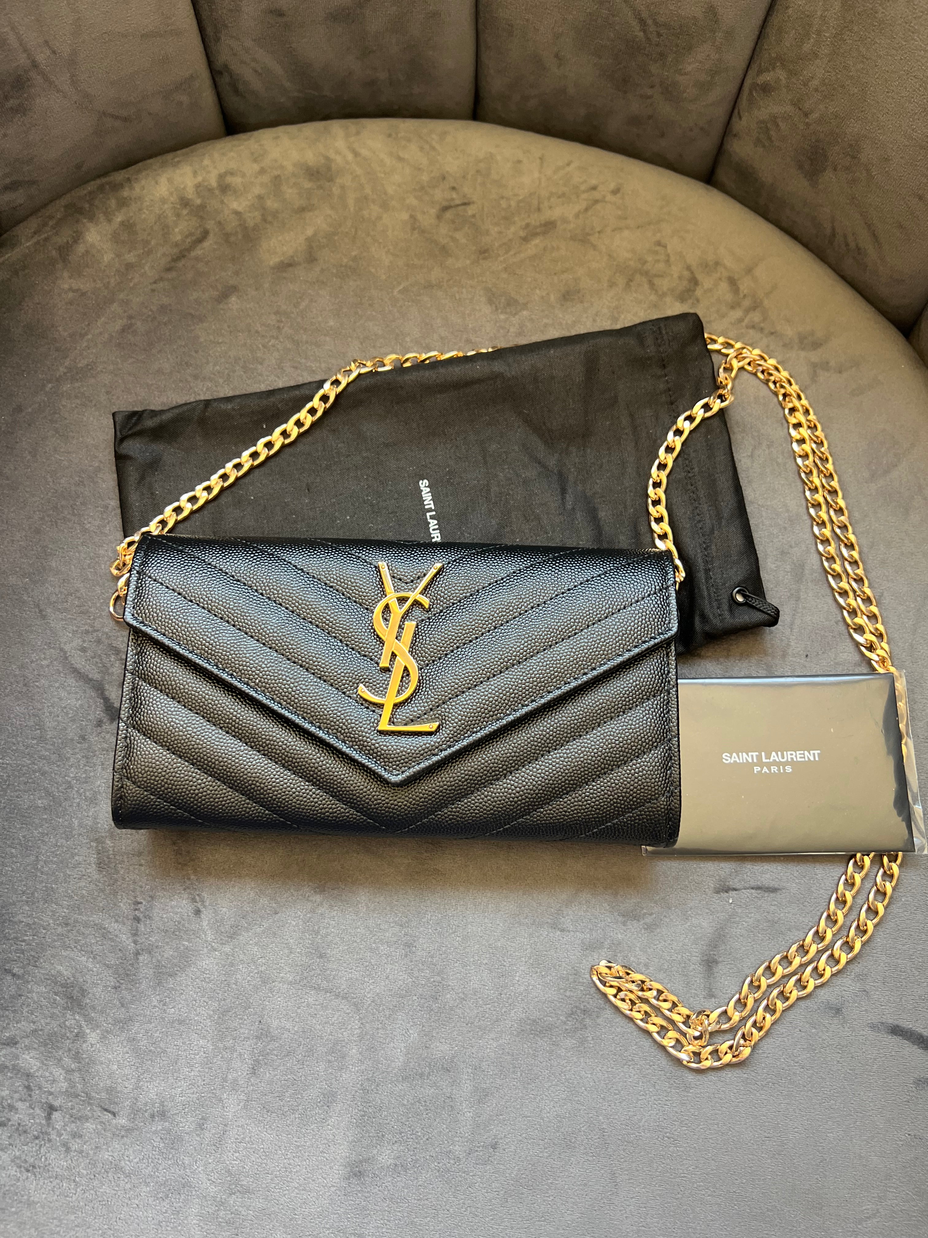 Black YSL cassandre envelope wallet on chain