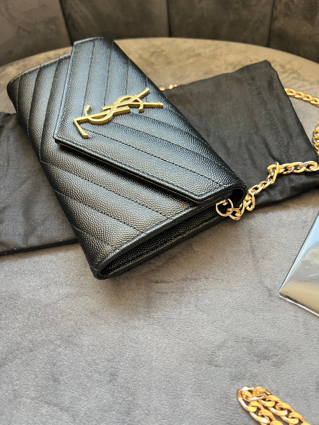 Black YSL cassandre envelope wallet on chain
