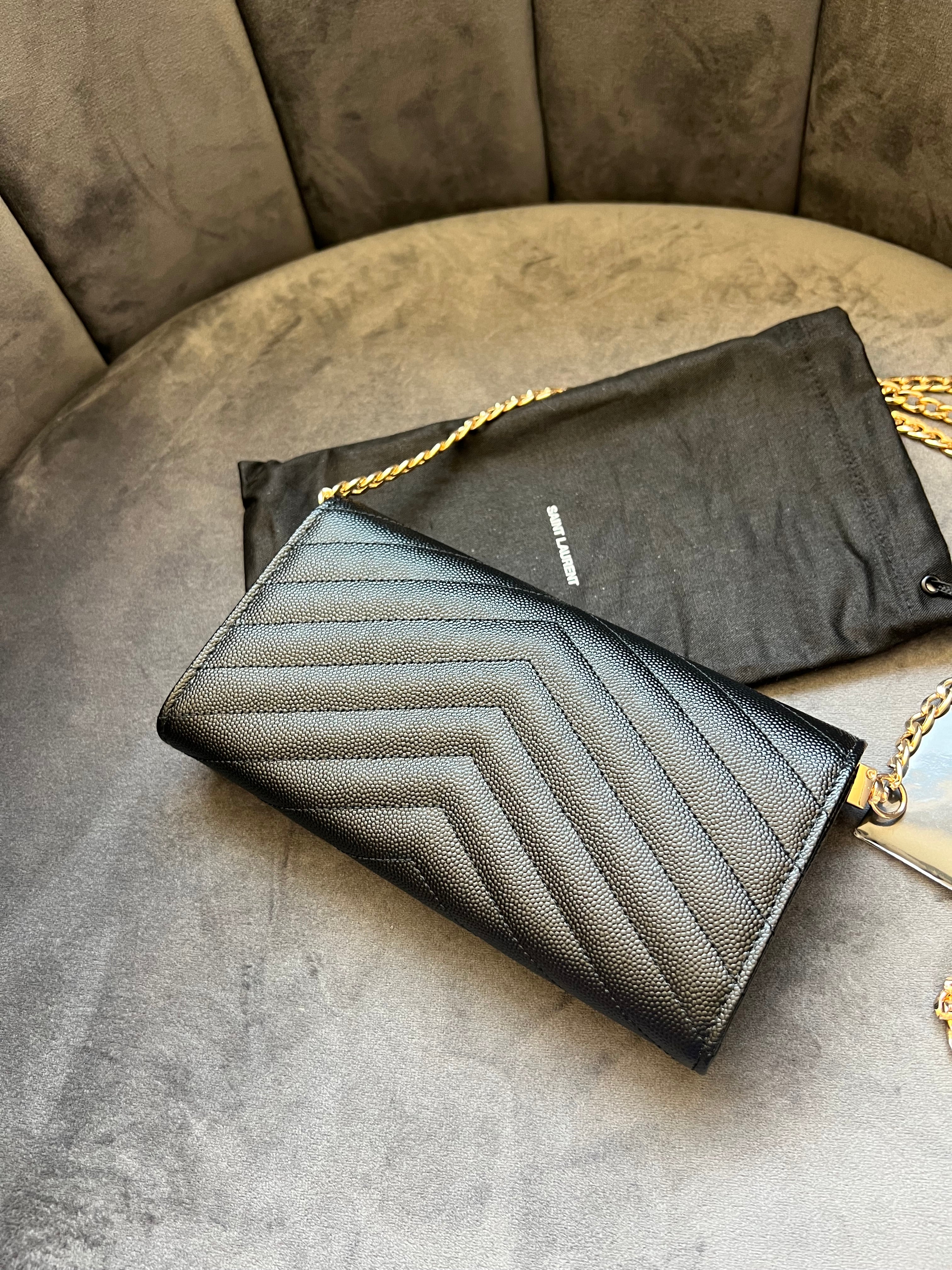 Black YSL cassandre envelope wallet on chain