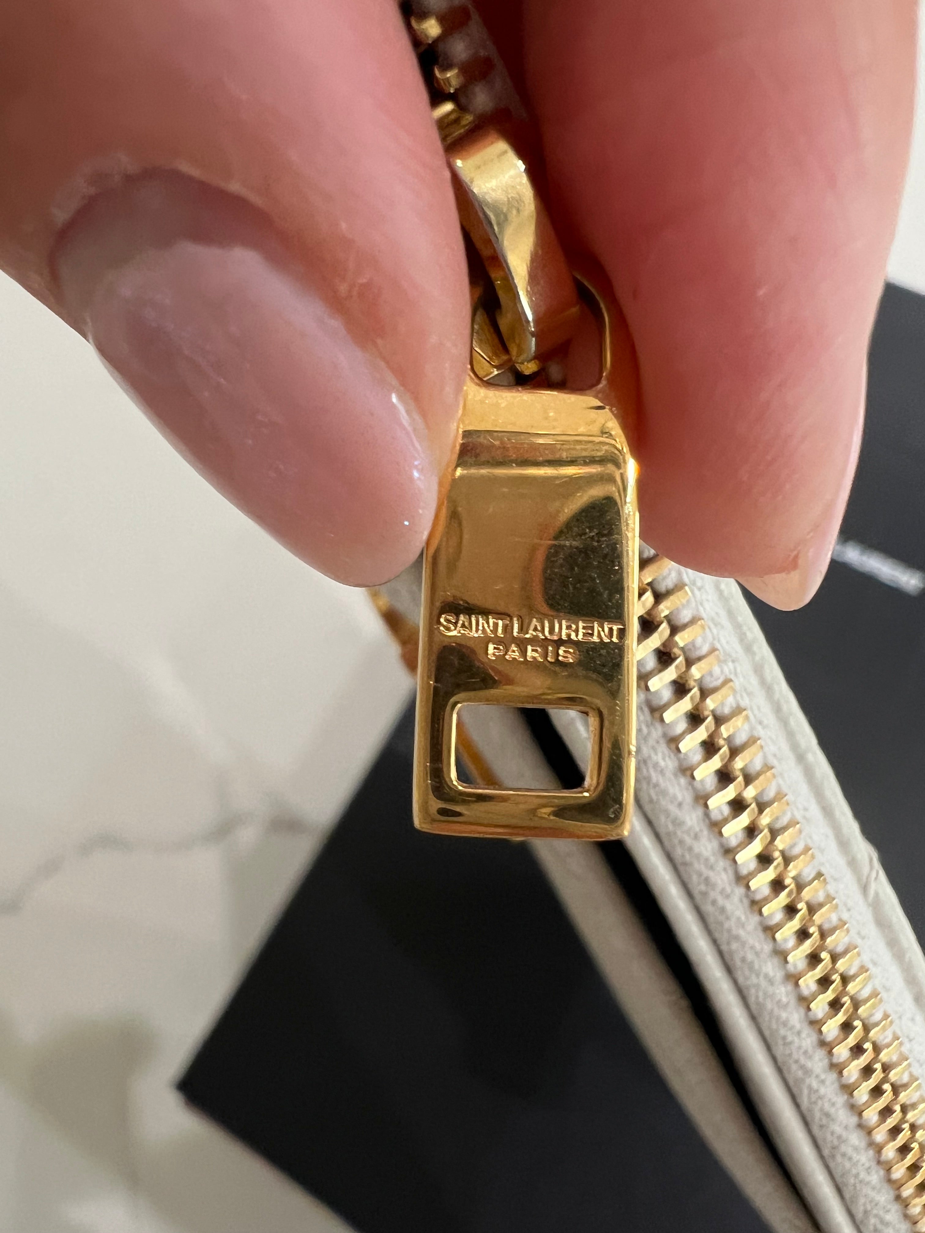 Creme YSL monogram clutch wallet on chain