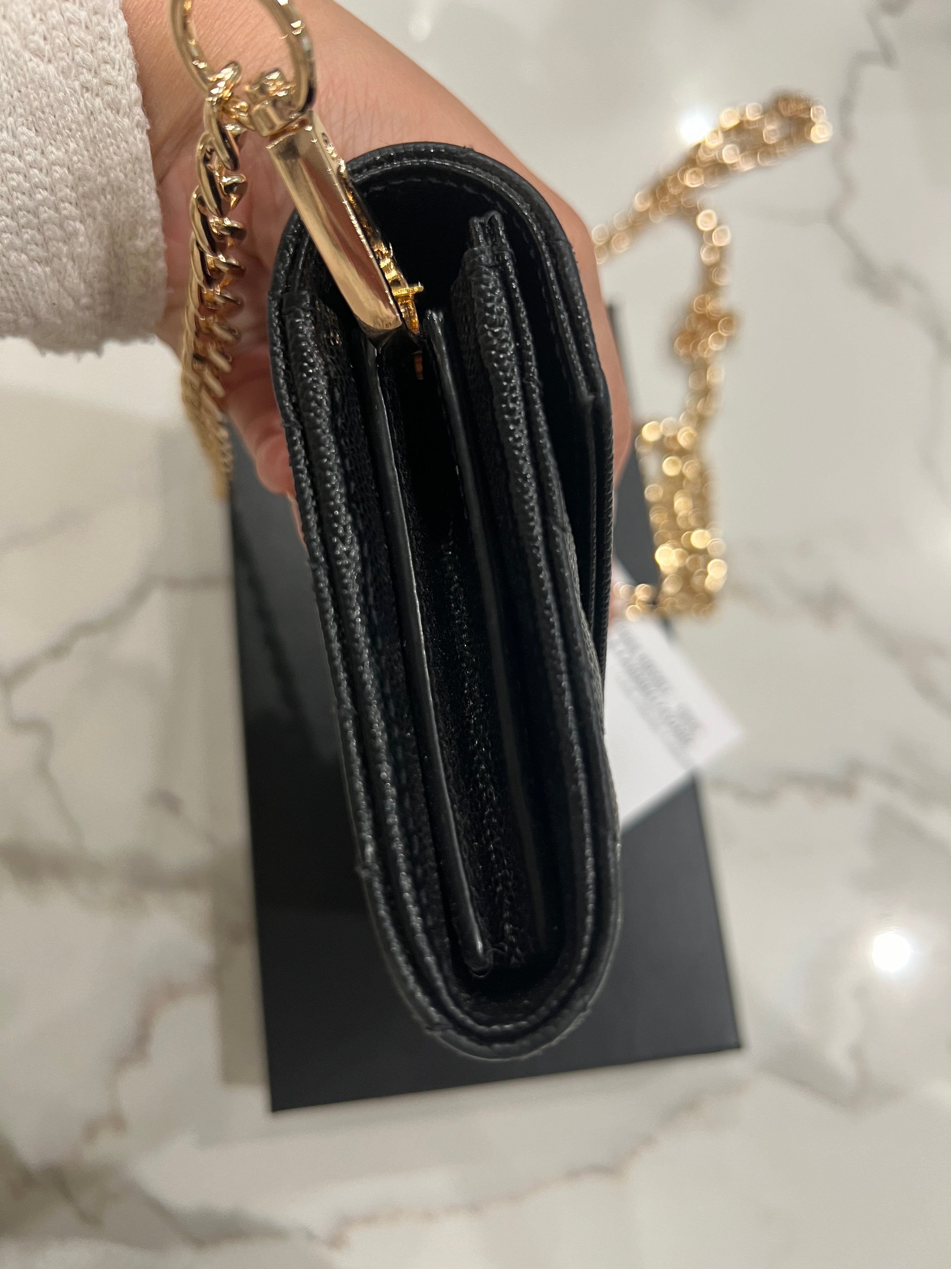 Black YSL cassandre envelope wallet on chain