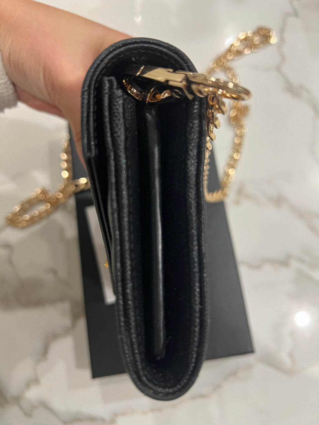 Black YSL cassandre envelope wallet on chain