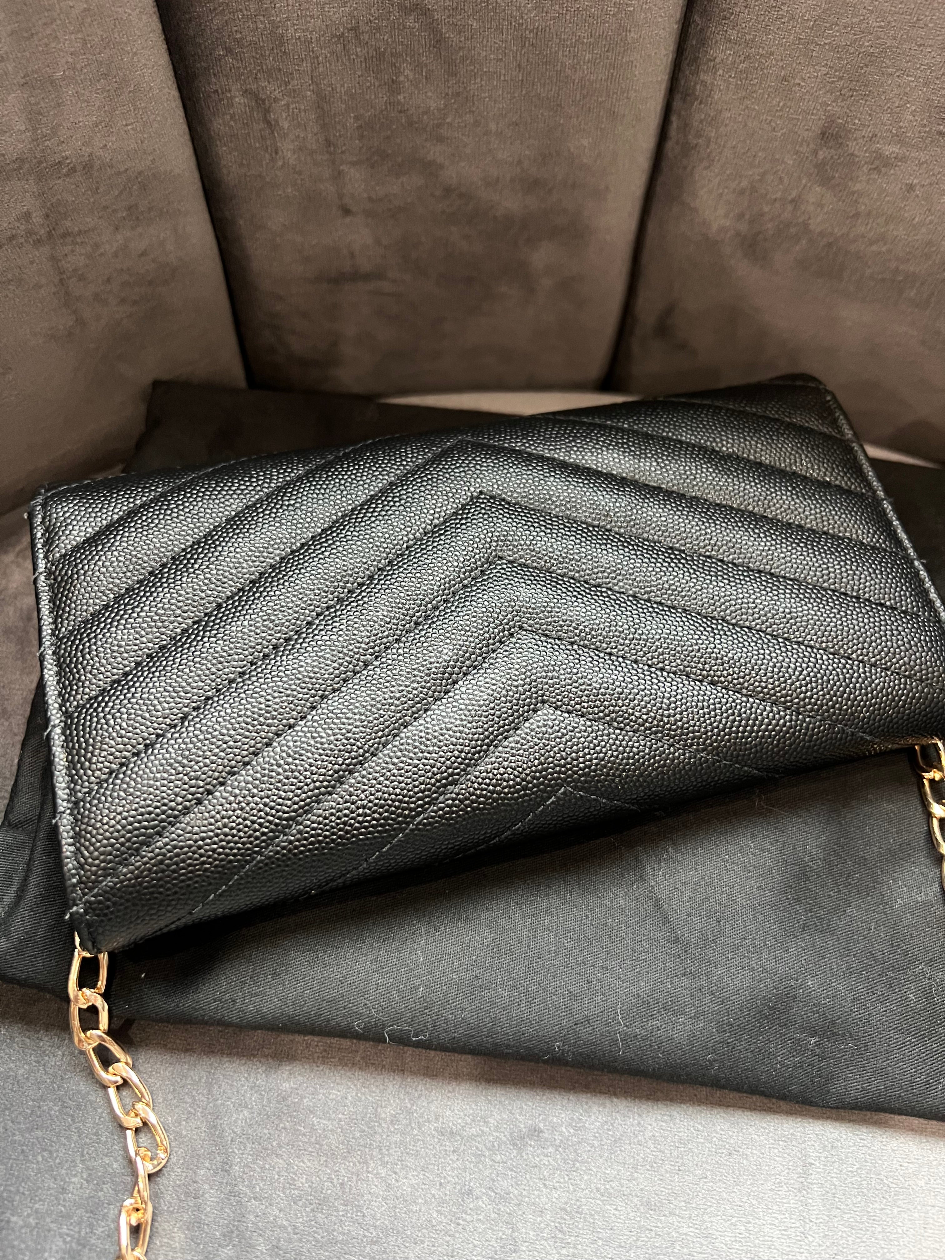Black YSL cassandre envelope wallet on chain
