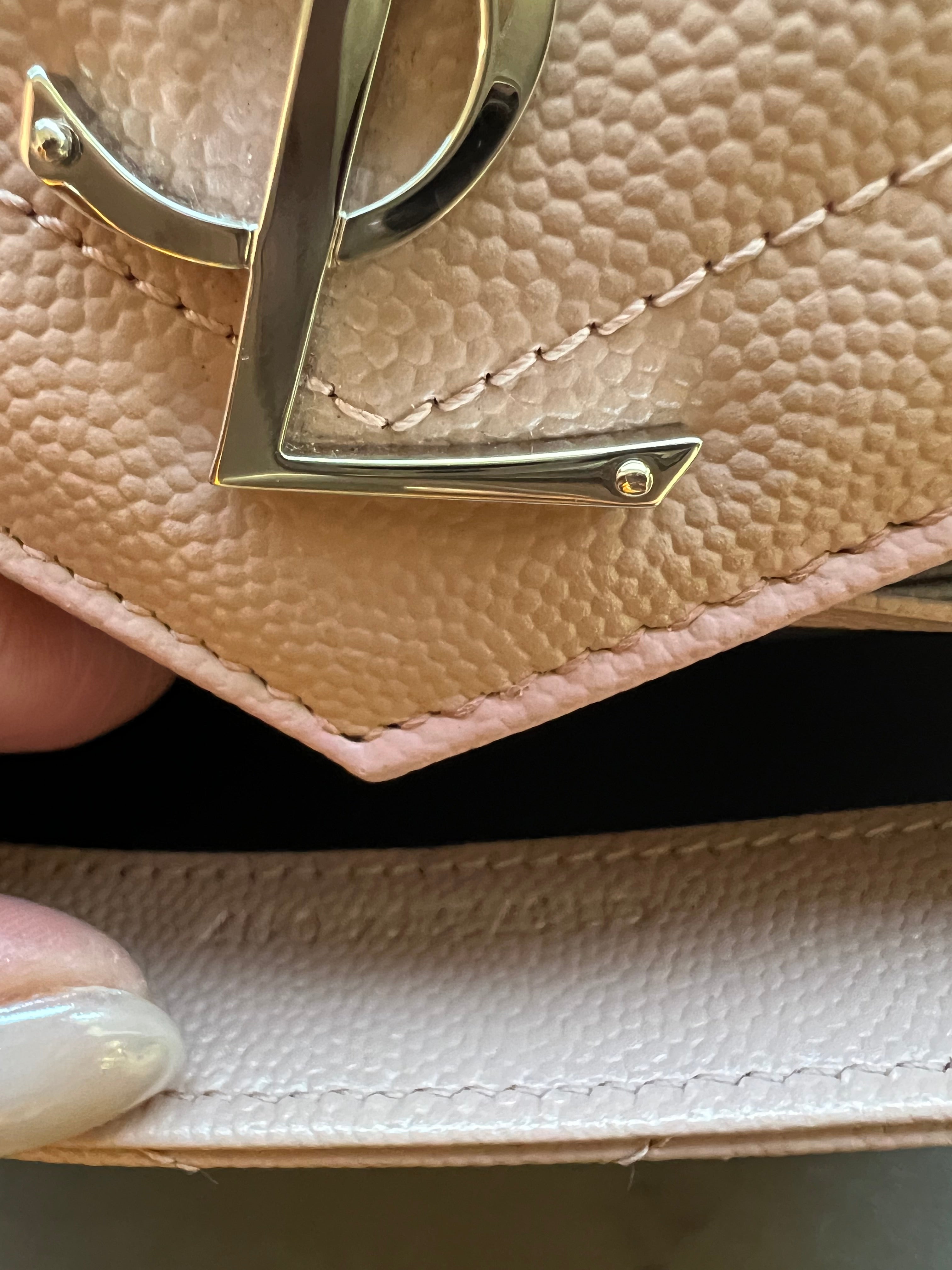 Pink YSL cassandre wallet on chain