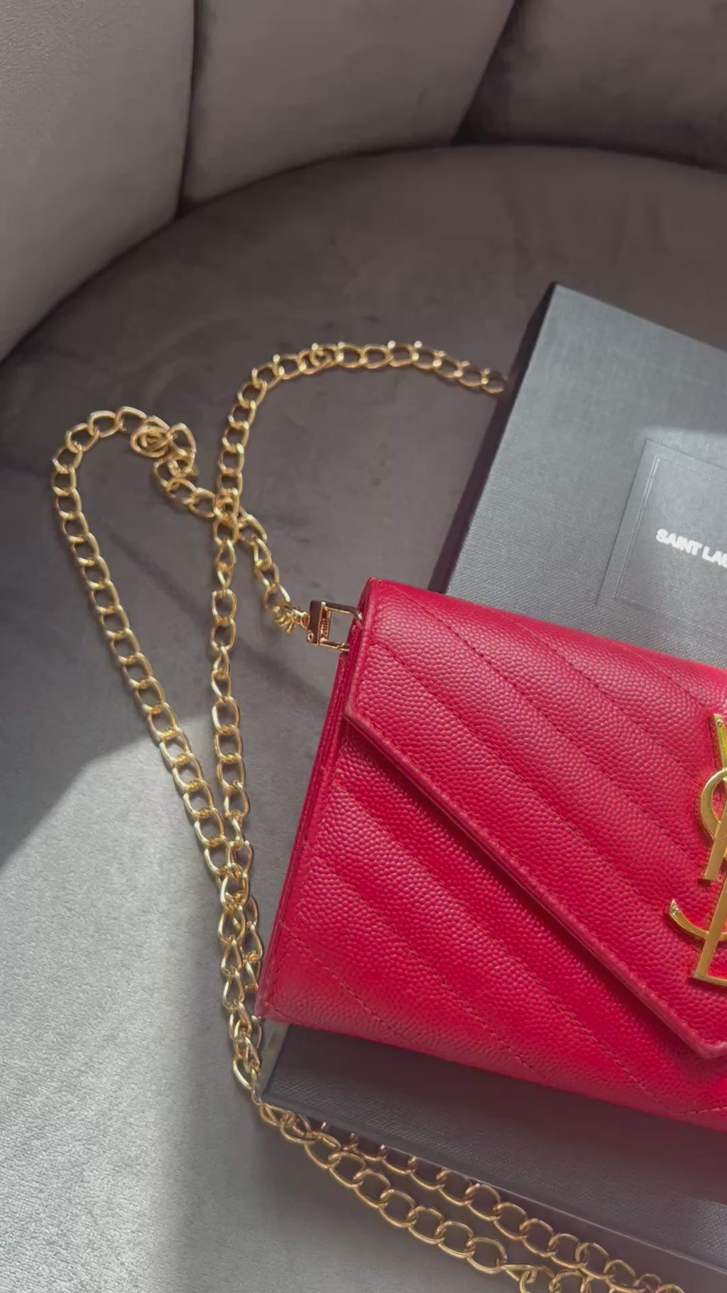 Yves Saint Laurent Cassandre envelope wallet on chain red