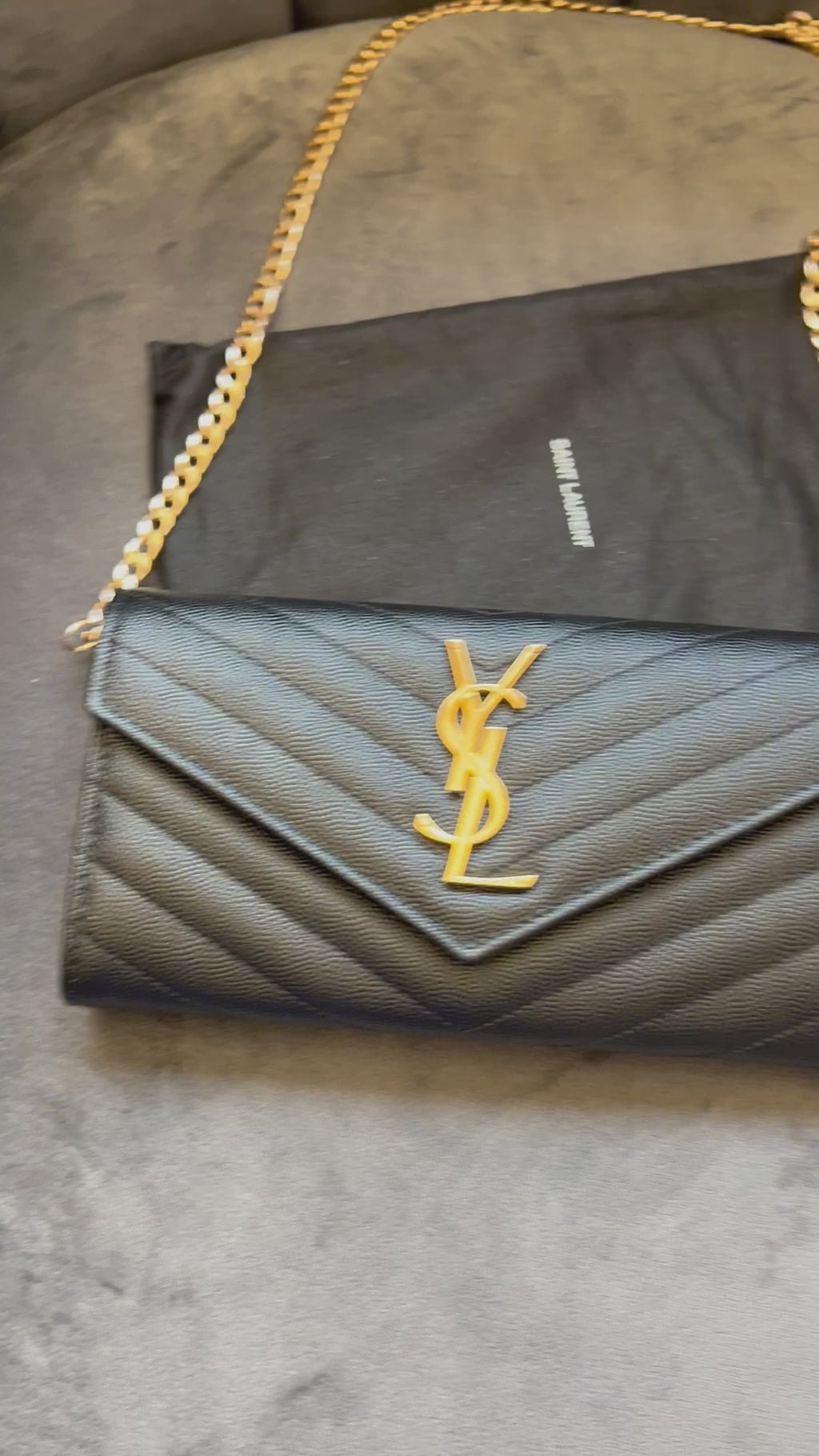 Black YSL cassandre envelope wallet on chain