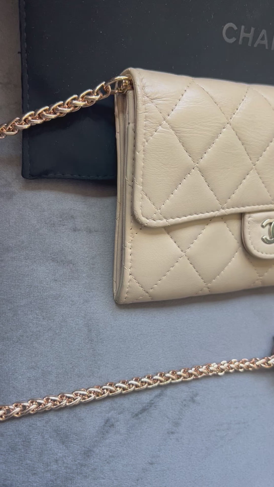 Beige gusseted Chanel timeless wallet on chain